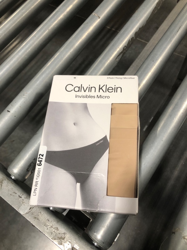 Photo 2 of Calvin Klein Women's Invisibles Seamless Thong Panties, 3 Pack, Light Caramel 3 Pack, Medium