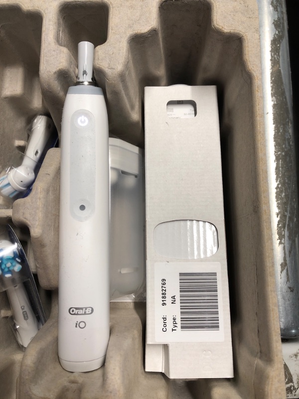 Photo 4 of ***PREV OPENED, APPEARS UNUSED***
Oral-B iO Deep Clean + Protect Rechargeable Electric Toothbrush, White with a iO Series 7 Toothbrush, 2 Replacement Brush Heads, and a Charging Travel Case