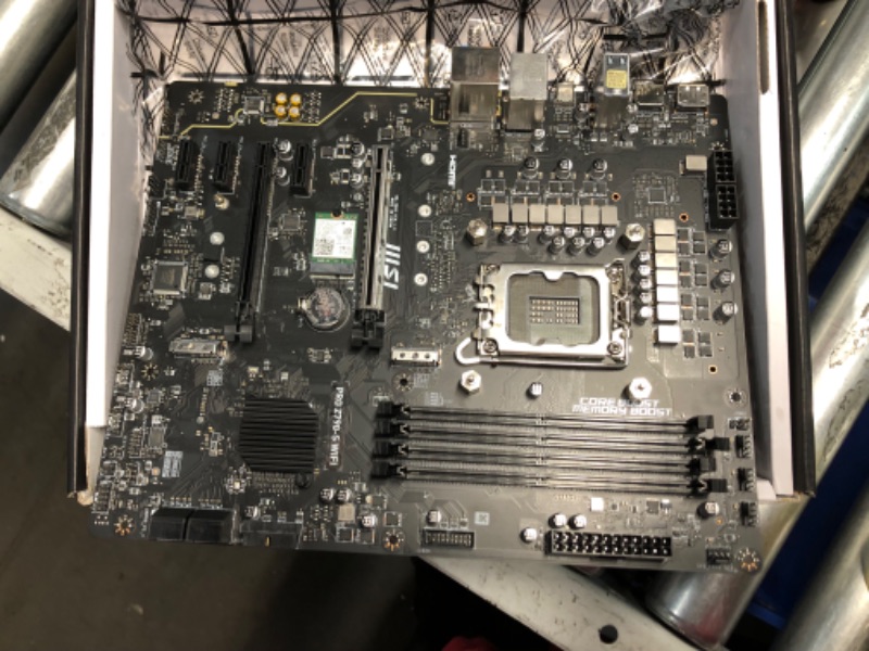 Photo 1 of ***NONREFUNDABLE - MAJOR DAMAGE - PARTS ONLY - SEE COMMENTS***
MSI PRO Z790-S WiFi ProSeries Motherboard (Supports 12th/13th/14th Gen Intel Processors, LGA 1700, DDR5, PCIe 5.0, M.2, 2.5Gbps LAN, USB 3.2 Gen2, HDMI/DP, Wi-Fi 6E, Bluetooth 5.3, ATX)