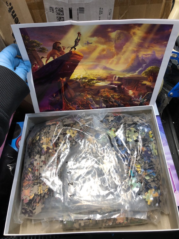 Photo 2 of ***FACTORY SEALED***Ceaco - Thomas Kinkade - The Disney Collection - Four 500 Piece Jigsaw Puzzles including Lion King, Peter Pan, Princess and the Frog & Jungle Book