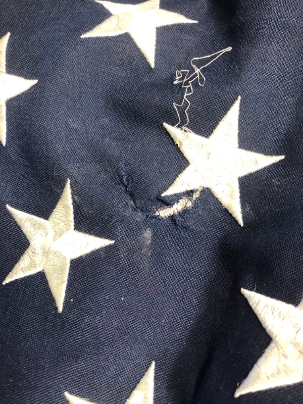 Photo 1 of **MINOR DAMAGE TEAR IN FLAG SEE PHOTO**
American Flag 4x6 Ft TearProof Series for Outside, Made in USA, Longest Lasting, Super Tough Fade Resistant Spun Polyester, High Wind US Outdoor Flags Embroidered Stars, Sewn Stripes, Brass Grommets