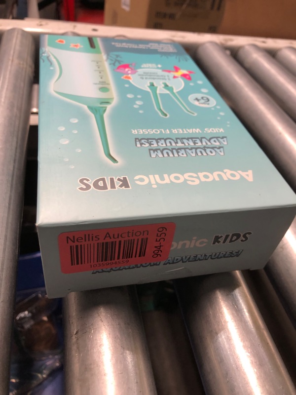 Photo 2 of ***FACTORY SEALED***AquaSonic Kids' Water Flosser for Ages 6+ | Standard Nozzle, Orthodontic Nozzle & Waterproof Stickers | 4 Flossing Modes | Aquarium Adventures Theme (Blue)