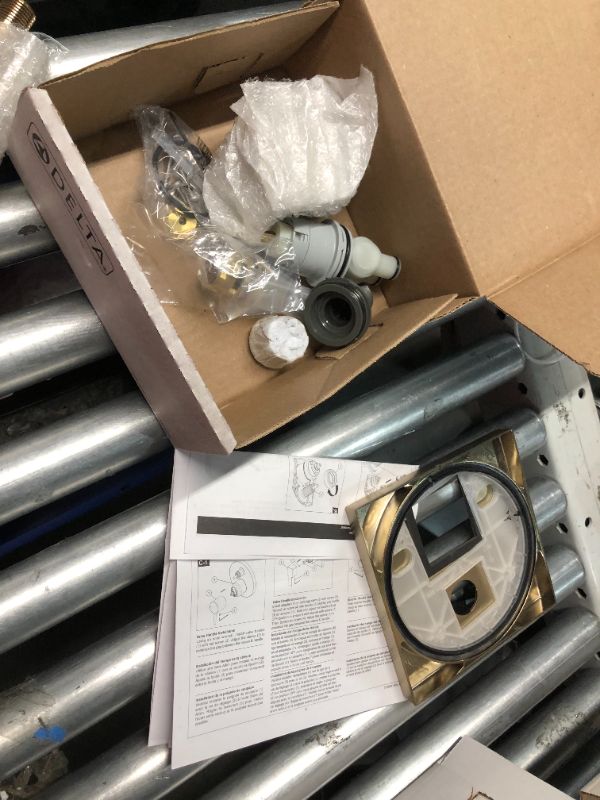 Photo 1 of ***USED - INCOMPLETE - LIKELY MISSING PARTS***
Delta Faucet Modern Raincan 2-Setting Square Shower System Including Rain Shower Head and Handheld Spray Gold, Rainfall Shower System Gold, Shower Valve and Trim Kit, Champagne Bronze 342701-CZ