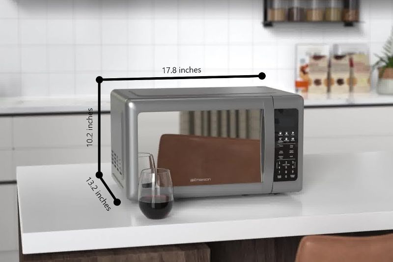Photo 1 of (POWER TESTED) (FAIR) Emerson MW7601SL Compact Countertop Microwave Oven with Sleek Mirrored Finish Door 10 Power Levels, 6 Auto Menus, Glass Turntable and Child Safe Lock, 0.7 Cu. Ft, Silver