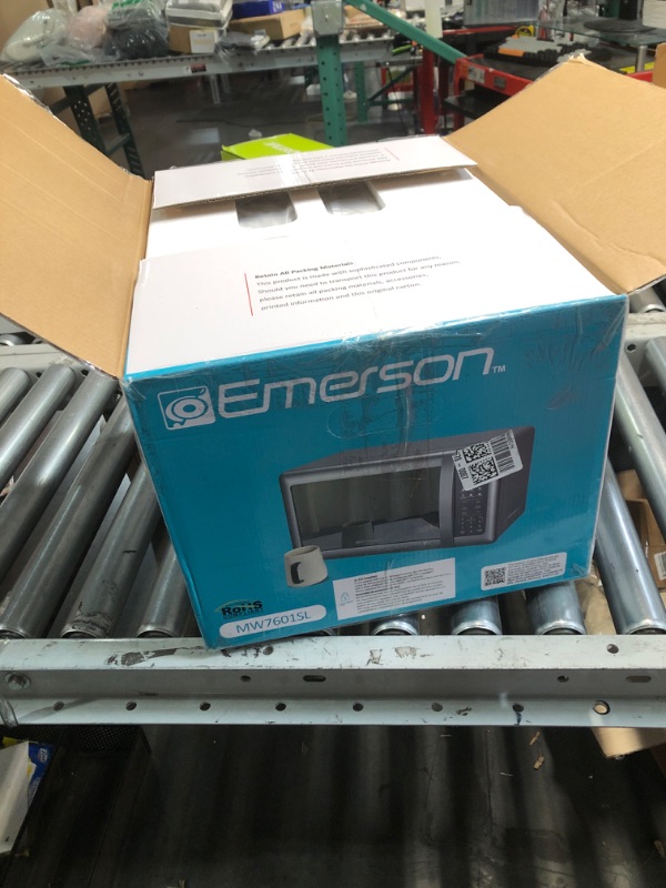 Photo 1 of (POWER TESTED) (FAIR) Emerson MW7601SL Compact Countertop Microwave Oven with Sleek Mirrored Finish Door 10 Power Levels, 6 Auto Menus, Glass Turntable and Child Safe Lock, 0.7 Cu. Ft, Silver