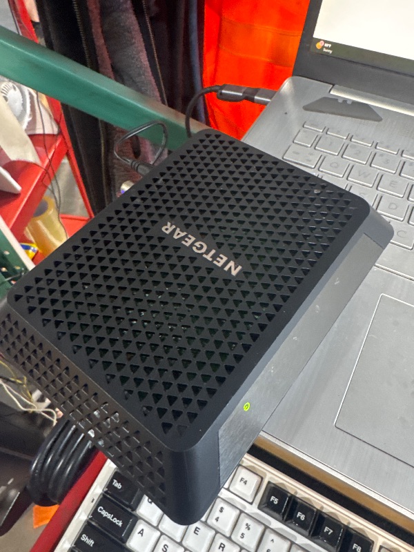 Photo 1 of (BASE IS MISSING) (FAIR) (POWER TESTED) NETGEAR Nighthawk Cable Modem CM700 - Compatible with all Cable Providers including Xfinity by Comcast, Spectrum, Cox | For Cable Plans Up to 1.4 Gigabits | 4 x 1G Ethernet ports | DOCSIS 3.0, Black
