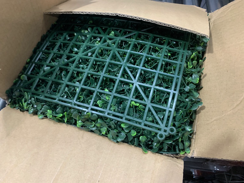 Photo 1 of (USED/FAIR) Bybeton Artificial Grass Wall Panel,10"x 10"(12Pcs) Boxwood Faux Green Wall Panels for Interior Wall, Backdrop Wall,Garden Wall and Indoor Outdoor Plant Wall Decor