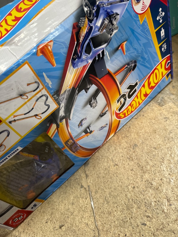 Photo 1 of Hot Wheels Toy Car RC Set with 1:64 Scale Remote-Control Vehicle & 30+ Pieces of Race Track to Create Multiple Configurations