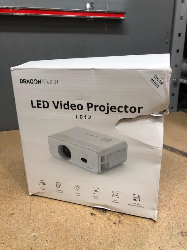 Photo 1 of Dragon Touch Mini Projector with WiFi and Bluetooth, 1080P Portable Movie Projector with Stand for Home/Outdoor, 12000L Electric Focus Projector Compatible with Phone/Laptop/TV Stick