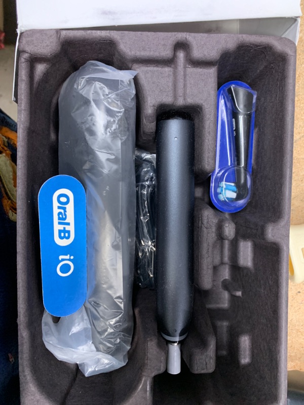 Photo 1 of Oral-B iO Deep Clean + Protect Rechargeable Electric Toothbrush, Black with a iO Series 7 Toothbrush, 2 Replacement Brush Heads, and a Charging Travel Case