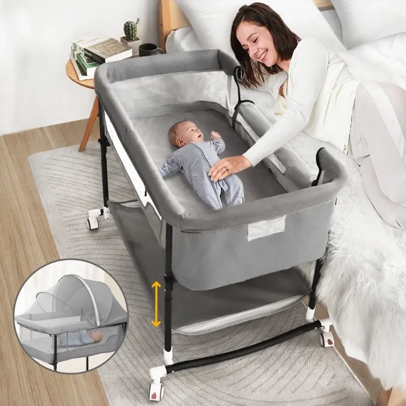 Photo 1 of Baby Bassinet, Caveen 4 in 1 Adjustable Infant Bedside Crib Beds with Changing Table, Storage Basket, Wheel, Mosquito Net, for 0-24 Months, Gray