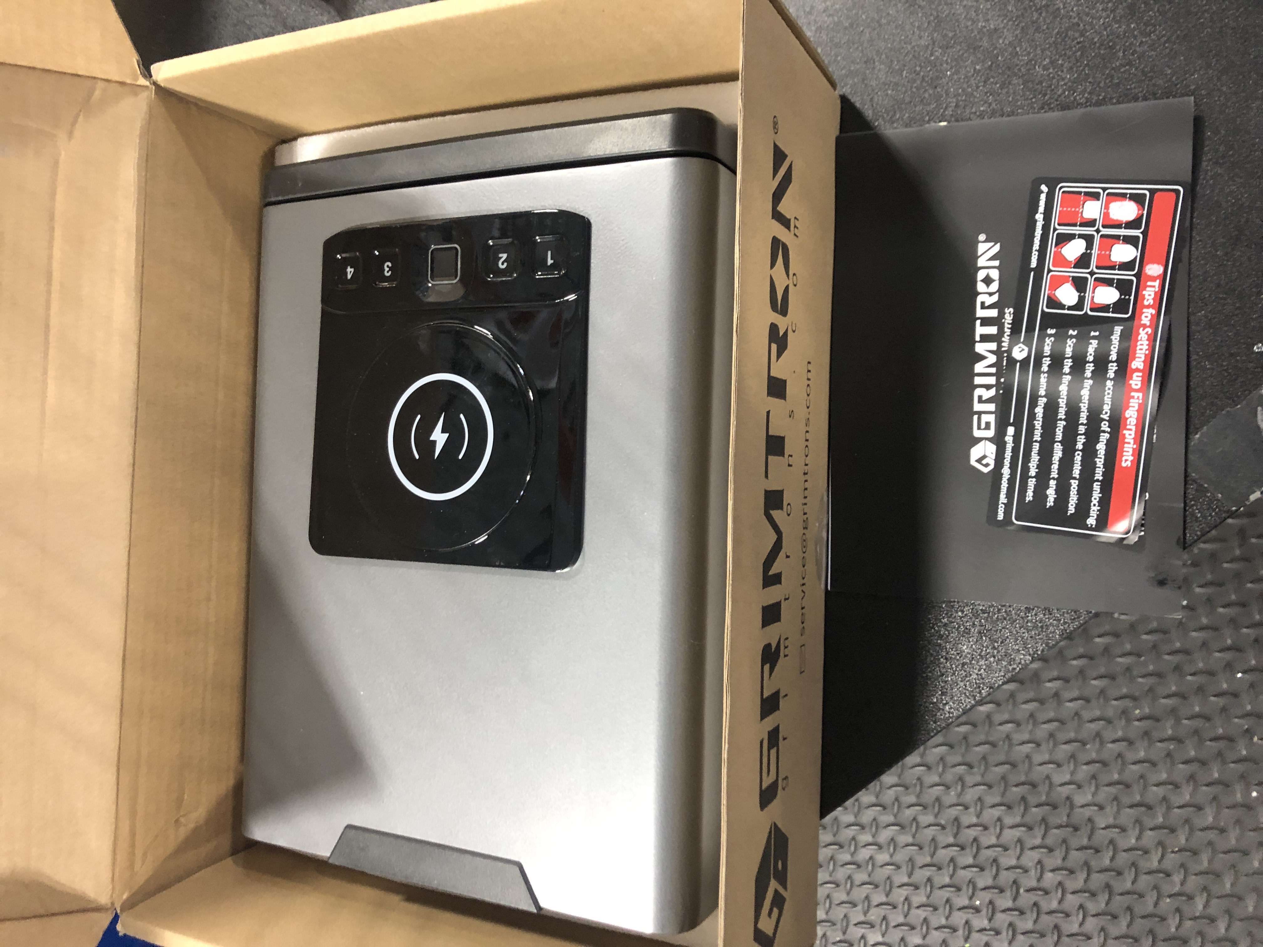 Photo 1 of Grimtron Biometric Gun Safe for Handgun, Smart Clock Safe with 2-in-1 Watch & Phone Wireless Charging, Bedside Pistol Safe with Backlit Keypad, Nightstand Handgun Safe with LED Light