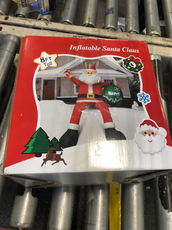 Photo 2 of 8 FT Christmas Inflatable Santa Claus Outdoor Decorations, Blow up Sitting Santa Claus with Gift Bag, Climbing Santa Carrying Present Sack Sitting on Roof, Xmas Yard Patio Bench Shrubs Indoor Decor