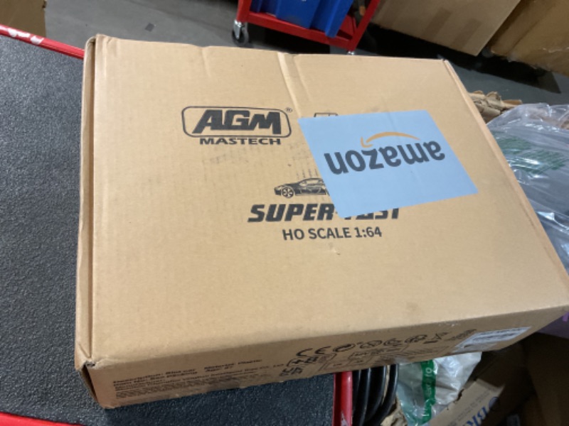 Photo 1 of AGM MASTECH High Speed Series Dual Track Set, 8.4m Electric Track with 4 Vehicles Official Licensed Slot car Racing, Comes with 2 Hand Controls and Track Parts and a Lap Counter.