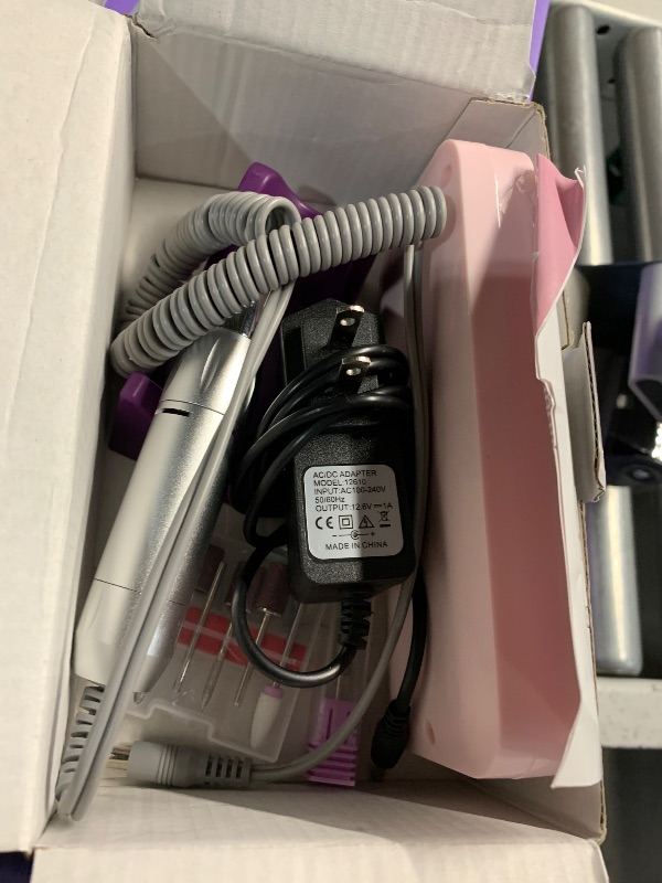Photo 1 of ***(MAJOR DAMAGE/ SEE NOTES)***
Portable Nail Drill Professional 35000 RPM, MOCOWIND Rechargeable Electric Nail File Machine E File for Acrylic Nails Gel Polishing Removing, Cordless E-file with Bits Kit for Manicure Salon Home,Pink