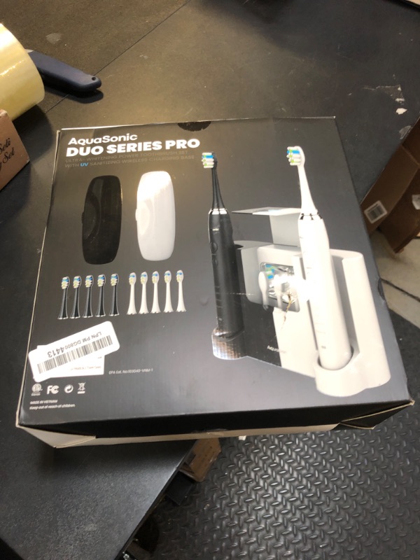 Photo 2 of AquaSonic DUO PRO – Ultra Whitening 40,000 VPM Electric ToothBrushes – ADA Accepted - 4 Modes with Smart Timers - UV Sanitizing & Wireless Charging Base - 10 ProFlex Brush Heads & 2 Travel Cases