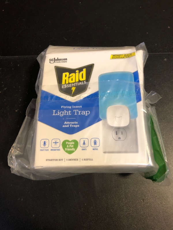 Photo 2 of Raid Essentials Flying Insect Light Trap Starter Kit, 1 Plug-In Device + 1 Cartridge, Featuring Light Powered Attraction