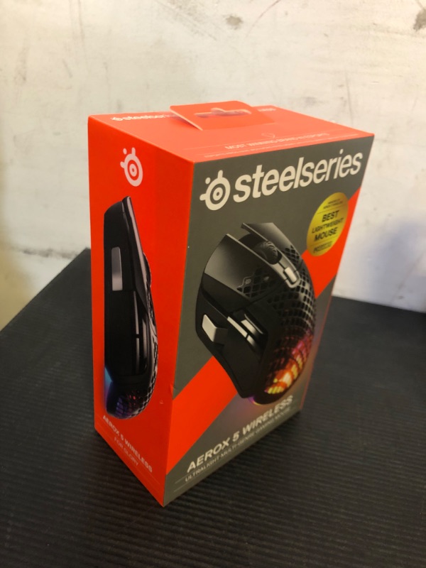 Photo 2 of SteelSeries Aerox 5 Wireless - Holey RGB Gaming Mouse - Ultra-lightweight Water Resistant Design - 9 Buttons – Bluetooth/2.4 GHz - 18K DPI TrueMove Air Optical Sensor