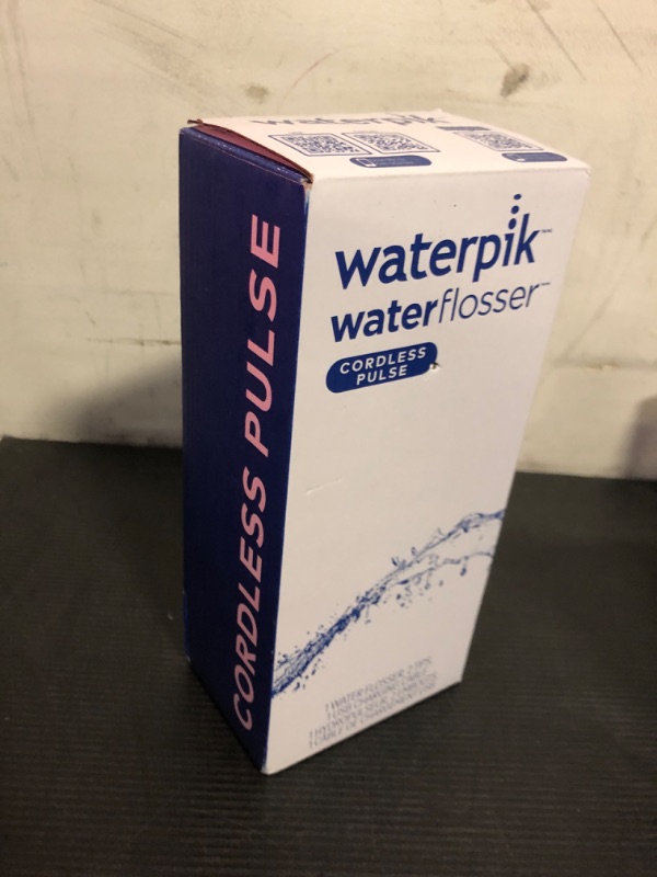 Photo 1 of Waterpik Cordless Pulse Rechargeable Portable Water Flosser for Teeth, Gums, Braces Care and Travel with 2 Flossing Tips, Waterproof, ADA Accepted, WF-20 White