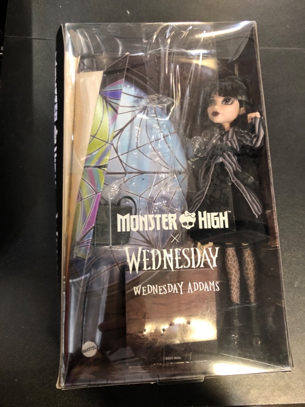 Photo 2 of Monster High Wednesday Doll and Accessories, Wednesday Addams Collectible in Nevermore Academy Uniform with Thing and Backpack, Doll Stand