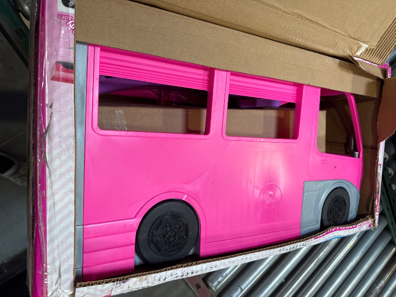 Photo 2 of Barbie Camper Playset, DreamCamper Toy Vehicle with 60 Doll-Sized Accessories Including Furniture, Pool & 30-inch Slide