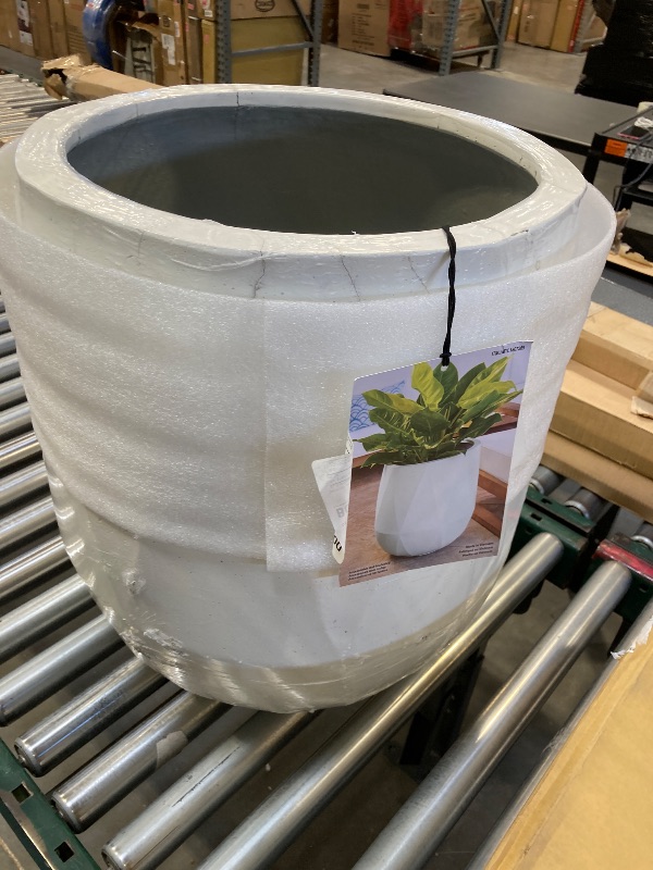 Photo 1 of White plant pot  - holds 64q *MINOR DAMAGE 