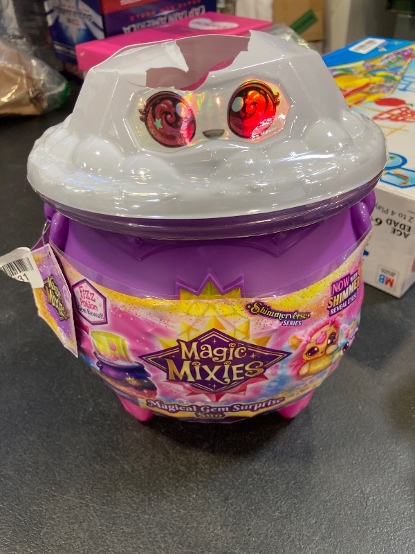 Photo 2 of Magic Mixies Magical Gem Surprise Cauldron: Sun. with New Shimmer Eyes! Reveal an Mixie Plushie from The Fizzing Cauldron and Discover 2 Magical Solar Gem Surprises! Styles May Vary