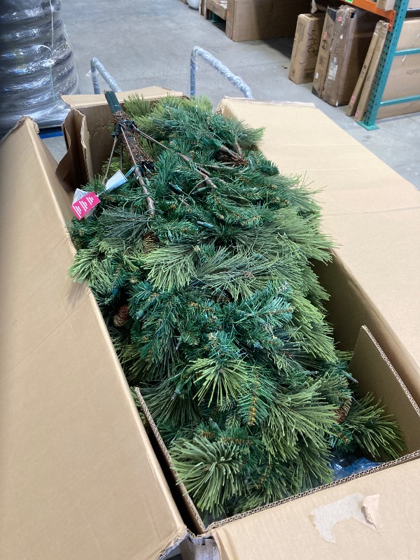 Photo 2 of National Tree Company Carolina Pine 7.5 Foot Artificial Holiday Prelit Christmas Tree w/750 Clear Lights, Pinecones, 1399 Branch Tips and Metal Stand