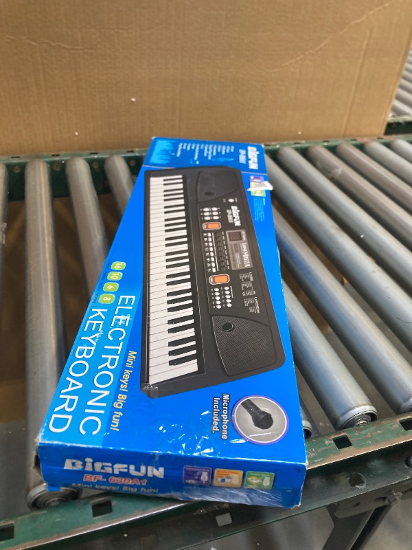 Photo 1 of LeeQee Piano Keyboard for Beginners, 61 Keys Digital Electronic Music Professional Piano with Microphone and Power Adaptor