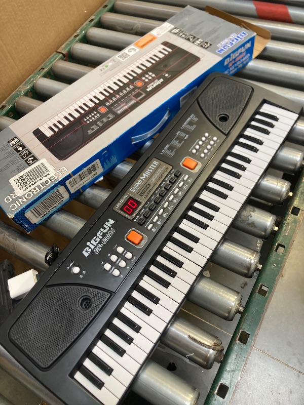 Photo 1 of LeeQee Piano Keyboard for Beginners, 61 Keys Digital Electronic Music Professional Piano with Microphone and Power Adaptor