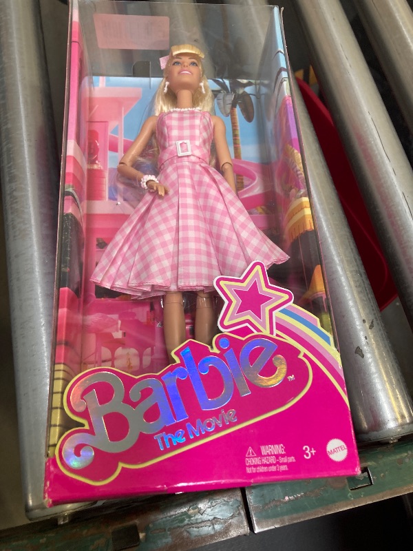 Photo 2 of Barbie The Movie Doll, Margot Robbie as, Collectible Doll Wearing Pink & White Gingham Dress with Daisy Chain Necklace
