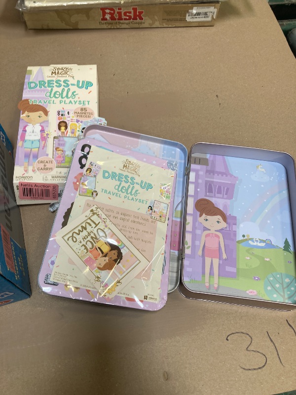 Photo 1 of Story Magic Dress-Up Dolls Playset, Pretend Play Magnetic Case, Magnet Outfit and Accessory Pieces, Great for Travel or Playdates, Magnetic On The Go Activity Set for Ages 4, 5, 6, 7 , Pink