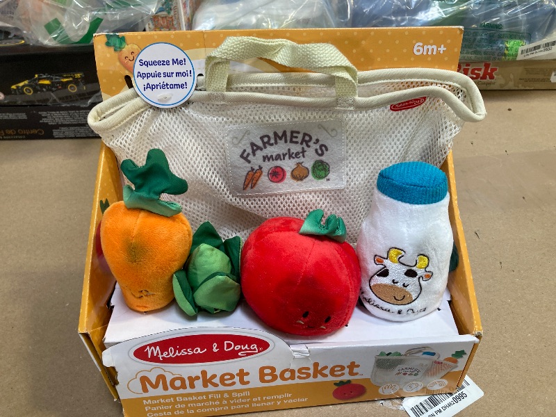 Photo 1 of Melissa & Doug Multi-Sensory Market Basket Fill & Spill Infant Toy - Play Food Menus, Pretend Play Grocery Toys, Sorting And Stacking Toys, Multi-Sensory Toys For Infants And Toddlers Ages 1+