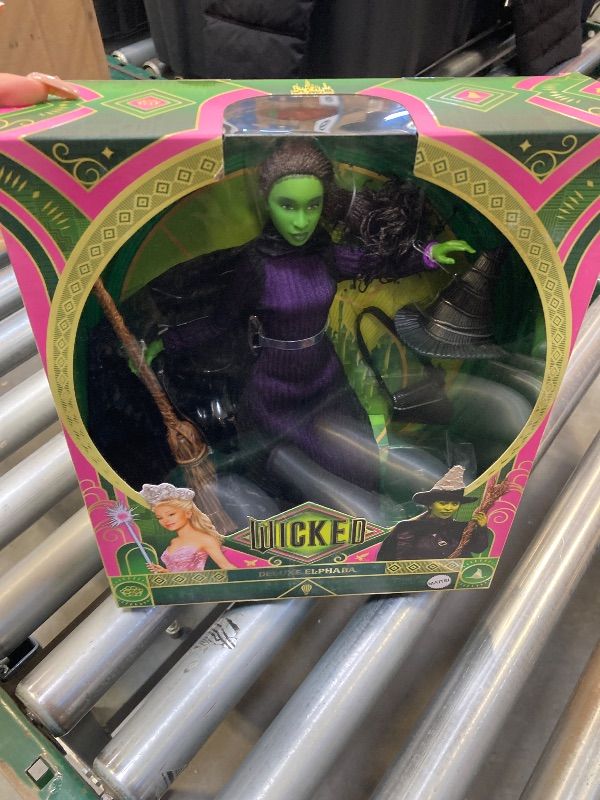 Photo 2 of Mattel Universal Wicked Deluxe Elphaba Fashion Doll & Accessories, Movie-Inspired Look with Braided Hair & Posability