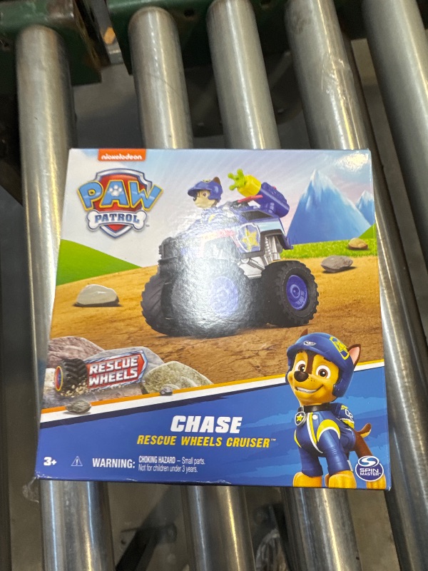 Photo 2 of Paw Patrol: Rescue Wheels Chase’s Cruiser, Toy Truck with Projectile Launcher and Collectible Action Figure, Kids Toys for Boys & Girls Ages 3 and up