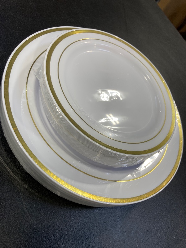Photo 1 of Gold and White plates with Gold Silverware
