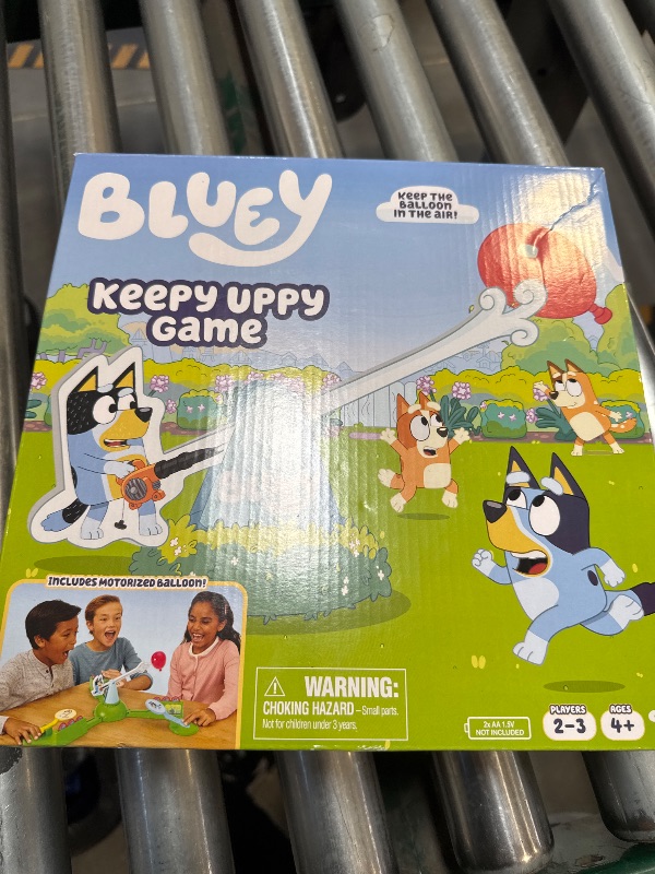 Photo 2 of Bluey Keepy Uppy Game. Help, Bingo, and Chilli Keep The Motorized Balloon in The Air with The Character Paddles for 2-3 Players. Ages 4+