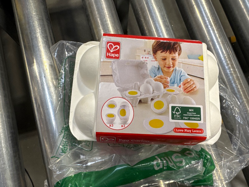 Photo 2 of Hape Egg Carton | 3 Hard-Boiled Eggs with Easy-Peel Shell & 3 Fried, Wooden Realistic Educational Toy for Children 3+, White and Yellow (E3156)