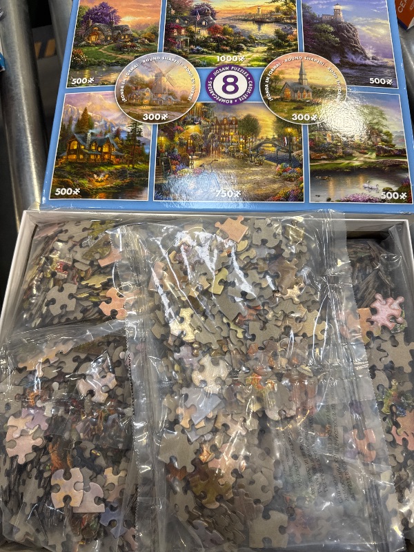 Photo 2 of Ceaco - 8 in 1 Multipack - Thomas Kinkade - (2) Round 300 Piece, (4) 550 Piece, (1) 750 Piece (1) 1000 Piece Jigsaw Puzzles