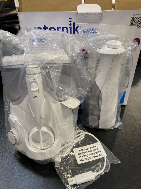 Photo 1 of Waterpik Ultra Plus and Cordless Pearl Water Flosser Combo Pack