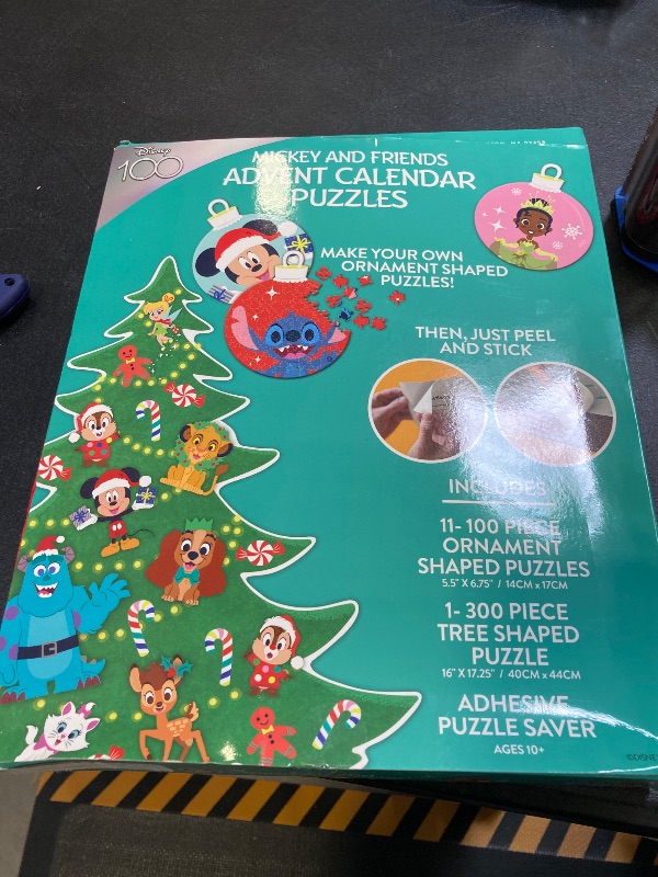 Photo 1 of Ceaco - Disney's 100th Anniversary – Mickey And Friends – 12 Days Of Christmas Advent Calendar Puzzles – Eleven 100 Piece Mini Ornament Jigsaw Puzzles And One 300 Piece Christmas Tree Jigsaw Puzzle – 1,400 Total Pieces