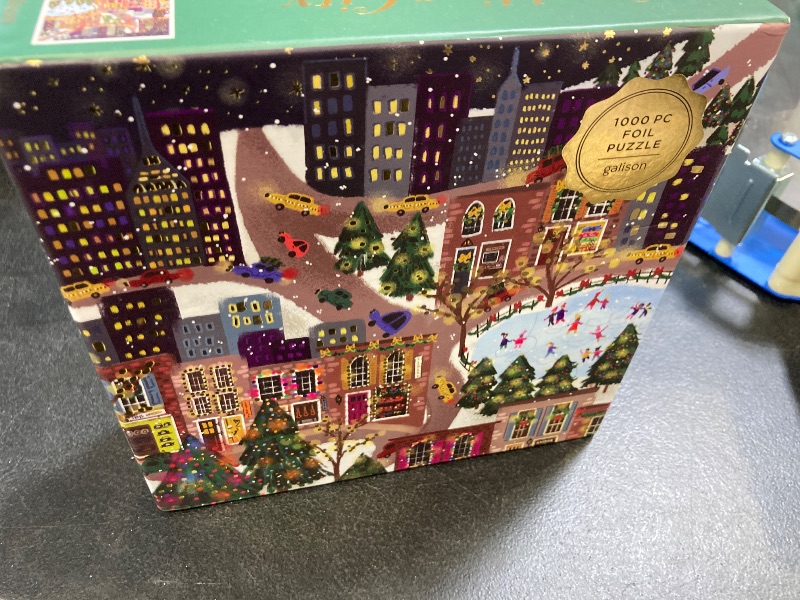 Photo 1 of Galison Sparkling City – 1000 Piece Foil Puzzle with Illustrations of Colorful Merriments in The City with Gold Foil Accents