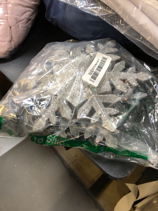 Photo 1 of Christmas Tree Topper Lighted with White Snowflake Projector, LED Rotating Snowflake, 3D Glitter Lighted Sliver Snow Tree Topper for Christmas Tree Decorations