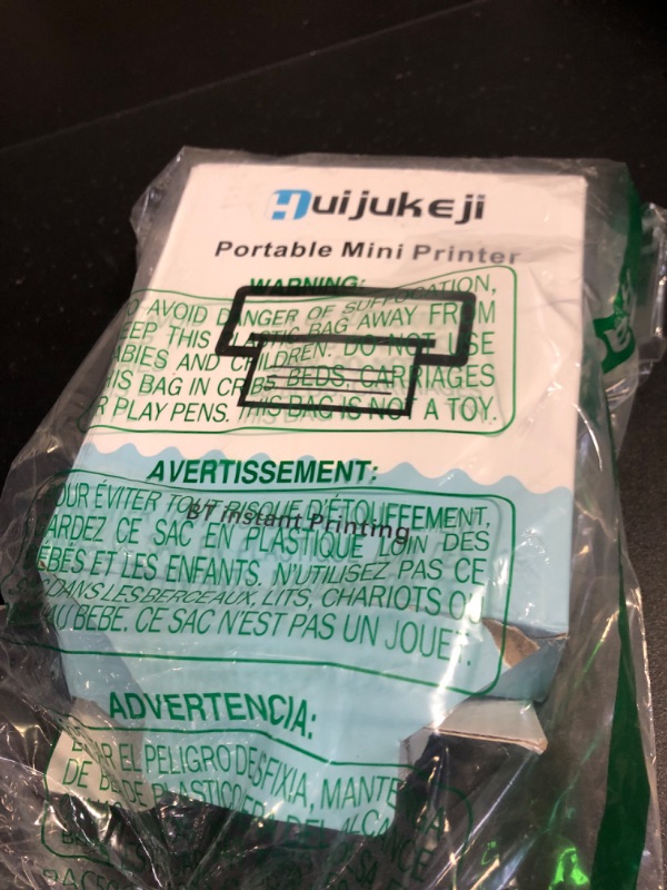 Photo 1 of HuiJuKeJi Mini Sticker Printer Pocket Inkless Thermal Printer with 11 Rolls Thermal Paper and Sticker for iOS&Android, Bluetooth Smart Portable Receipt Printer for Photo Journal Notes Memo-Green