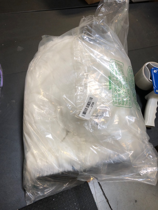 Photo 1 of WOMENS BOOTS FUZZY WHITE SIZE 10