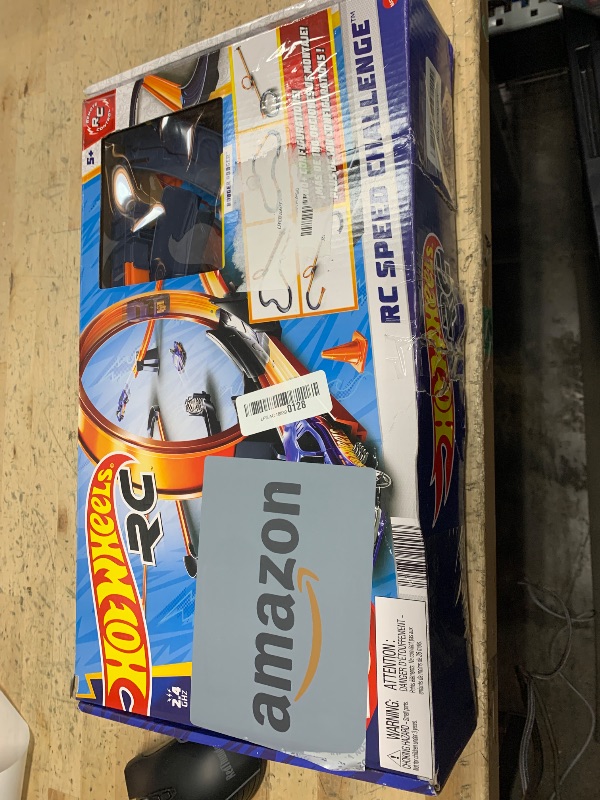 Photo 1 of Hot Wheels Toy Car RC Set with 1:64 Scale Remote-Control Vehicle & 30+ Pieces of Race Track to Create Multiple Configurations