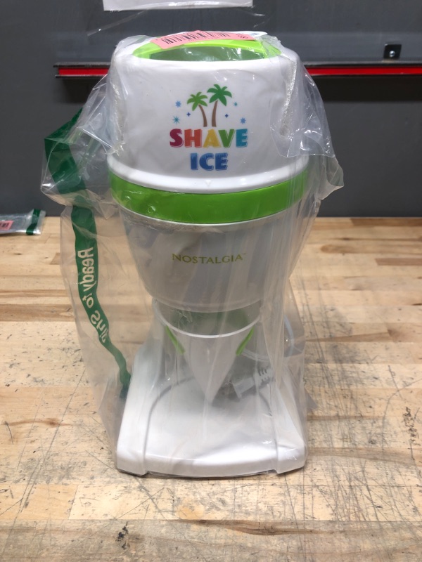 Photo 1 of Nostalgia NESHVICE3HSID1 Snow Cone Shaved Retro Table-Top Slushie Machine-Includes 1 Reusable Plastic Cup and Ice Molds, White, Green