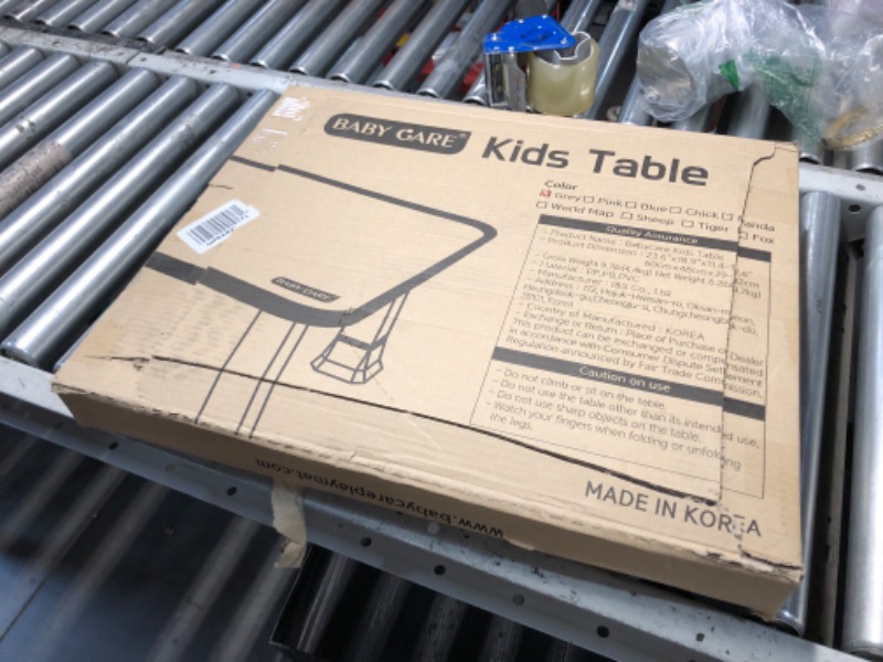 Photo 1 of **DAMAGED, TOP IS CUT FROM OPENING BOX**
Baby Care Kids Folding Floor Table w/Adjustable Heights - for Play, Reading, and Snack Time and More (White/Grey)