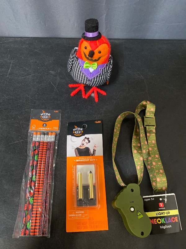 Photo 1 of 4 Item Seasonal & Party Supplies Bundle | Black/White Palette and Crayons + 'Gourdon' Halloween Decoration + 6ct Halloween Party Favors Pencils + Light Up Necklace Bigfoot