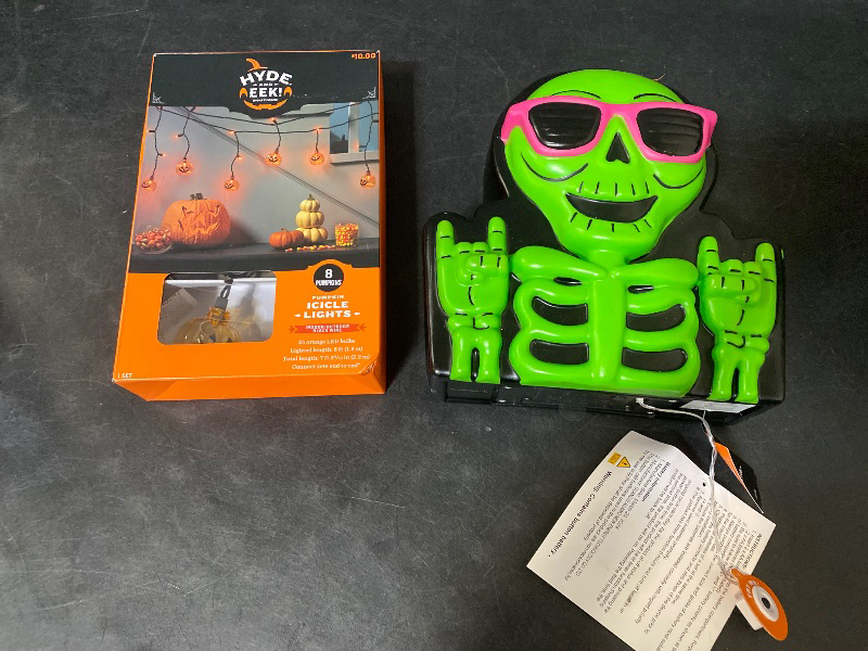 Photo 1 of 2 Item Seasonal & Party Supplies Bundle | 25ct LED Halloween Indoor/Outdoor Jack-O-Lantern + Blowmold Skeleton Halloween Decorative Sculpture